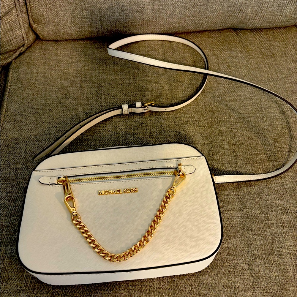 Michael Kors small cross body white leather purse, slightly ised